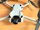 DJI Mini 4 Pro drone, aksesuarları ve taşıma çantası ile birlikte. - photo 1